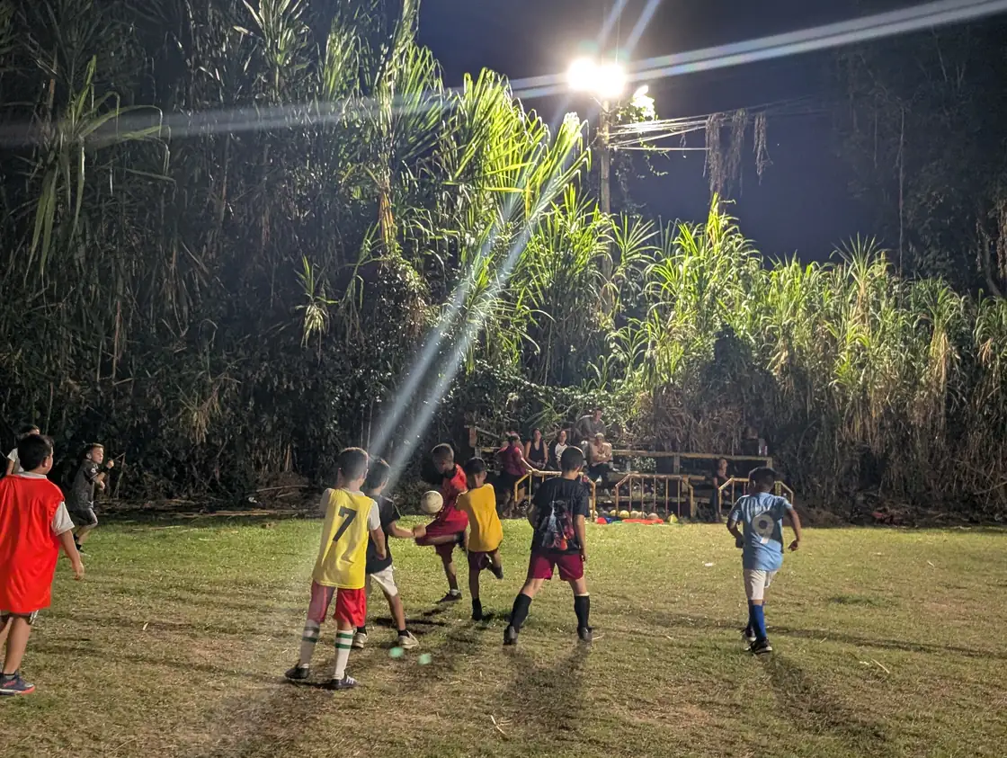 Alpha FC players taking part in an evening training session in Pereira